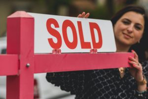 Photo by RODNAE Productions: https://www.pexels.com/photo/real-estate-agent-holding-a-signage-8293694/